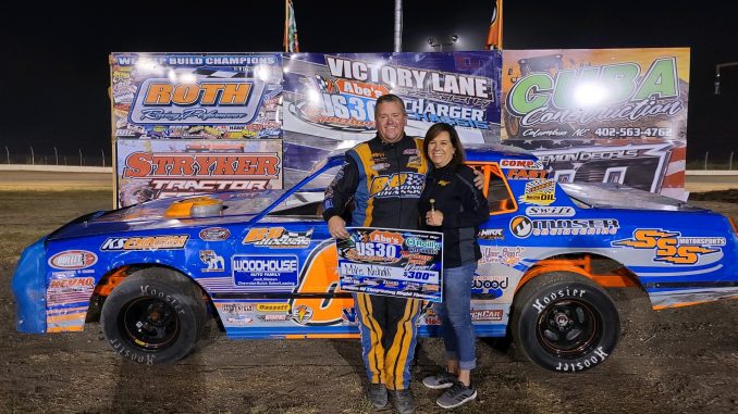 Mike Nichols moved to the top of IMCA’s all-time wins list with his career 558th IMCA Sunoco Stock Car feature win on Sept. 3 at Abe’s U.S. 30 Speedway in Columbus, Neb. He is pictured in victory lane with wife Anita. (Photo courtesy of Abe’s U.S. 30 Speedway)